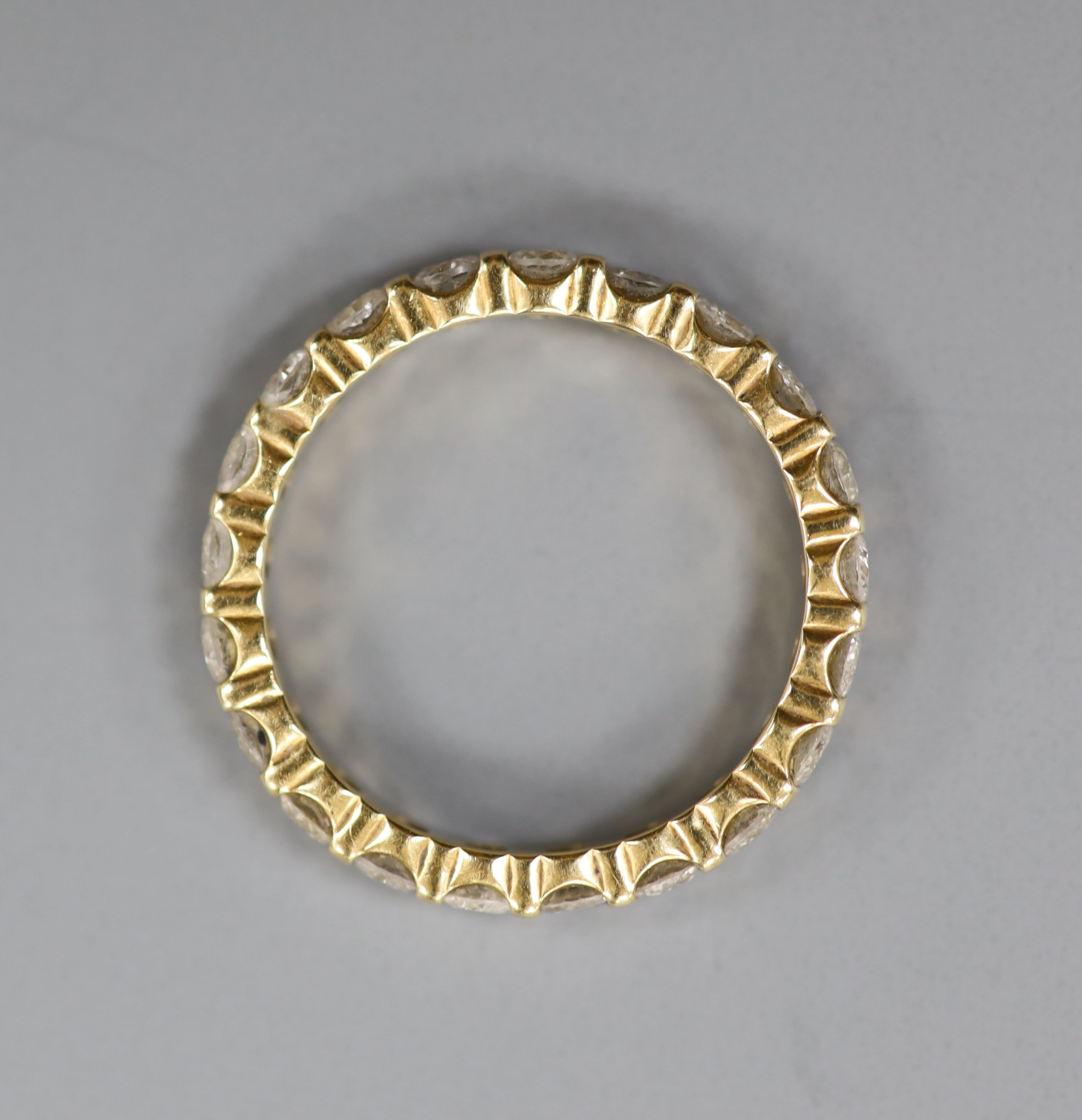 A modern 18ct gold and diamond set full eternity ring, size P, gross weight 3.8 grams.